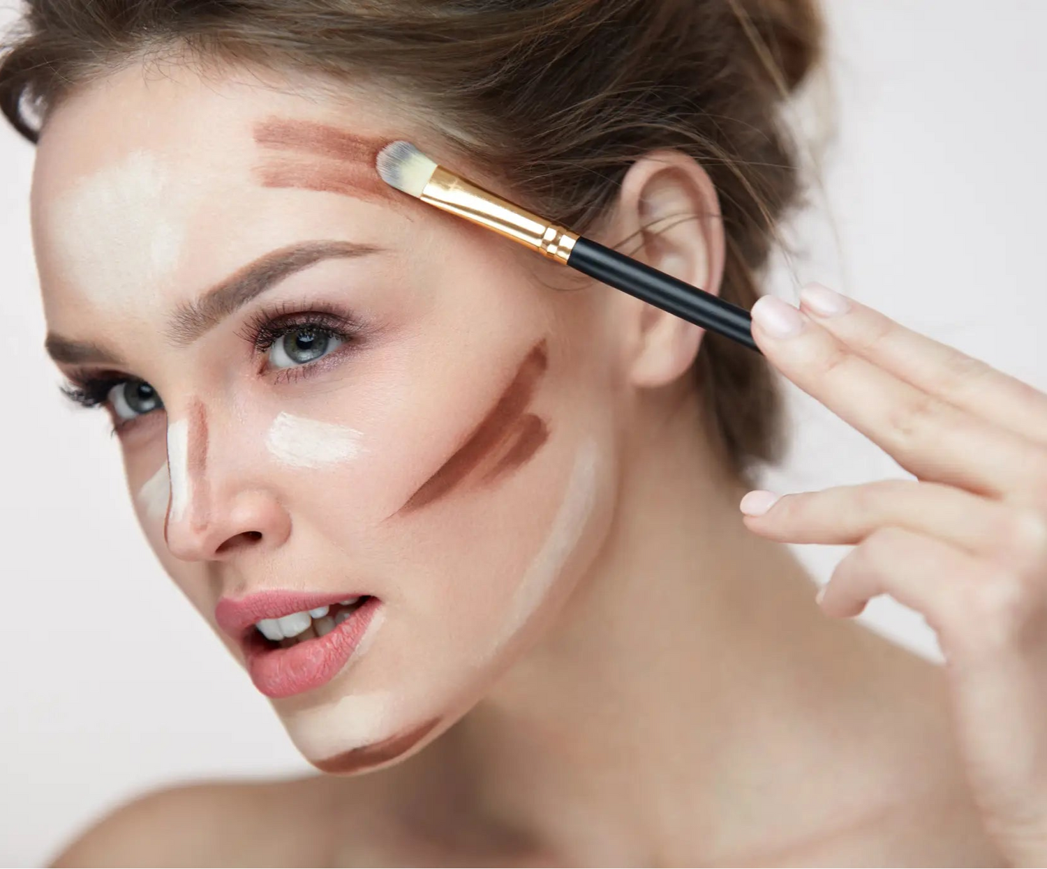 Woman using YAG brush used for contour